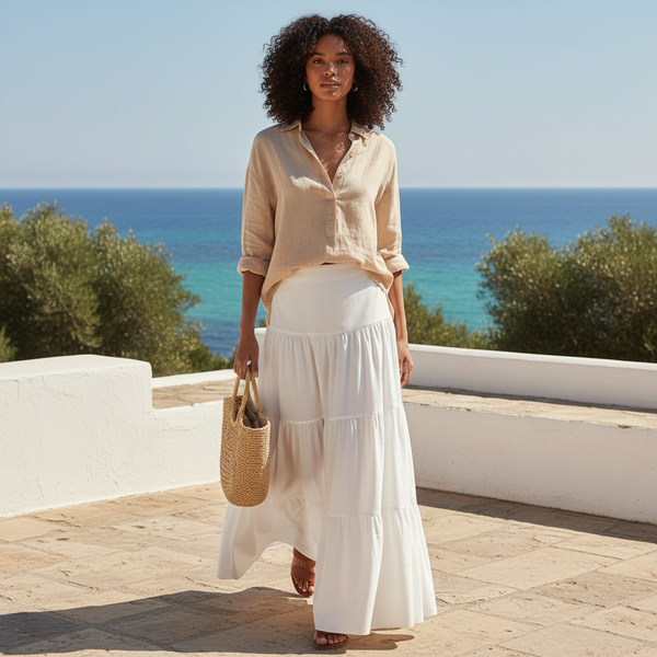 Jupe longue blanche fluide en coton léger, coupe évasée et taille haute, idéale en été. Image